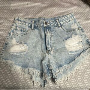 Light wash ripped jean shorts.